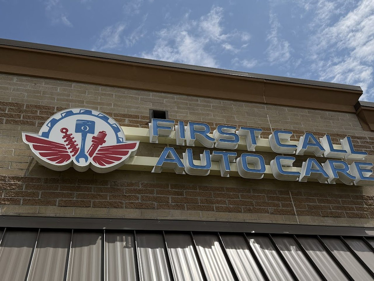 The First Call Auto Care sign on the front of the shop at 29444 Woodward Ave in Royal Oak, MI