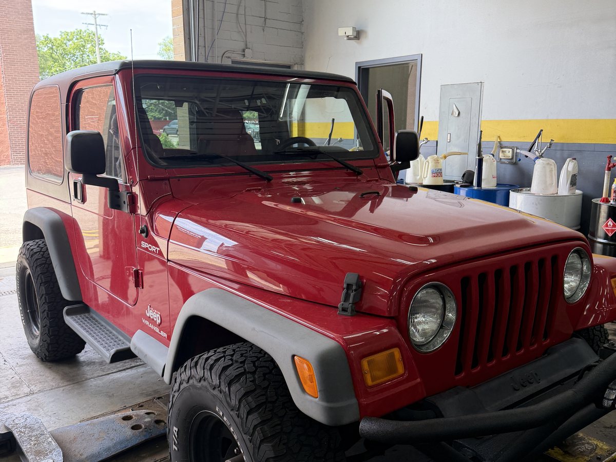 A Jeep Wrangler in a service bay at First Call Auto Care in Royal Oak, MI