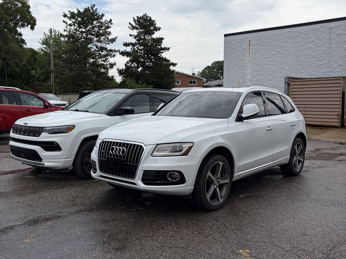 Customer vehicles of several different makes parked at First Call Auto Care in Royal Oak, MI